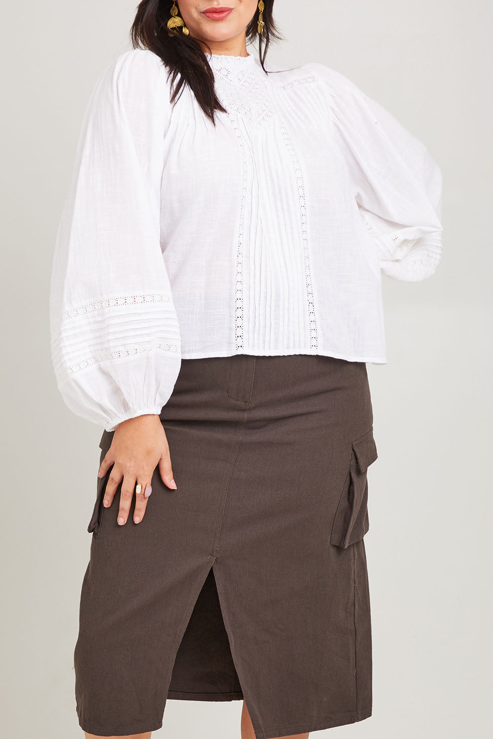 Model Poppy wearing size 16 of the My Fair Lady Blouse in colour White (White), from the front, cropped image