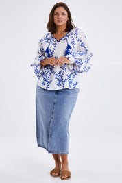 Model Monique wearing size 14 of the Feel My Vibe Embroidered Blouse in colour Whiteblue (White), from the front, showing the whole outfit