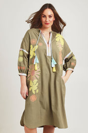 Model Jane wearing size 14 of the Now And Then Embroidered Tunic Dress in colour Khaki, from the front, cropped image