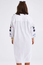 Model Monique wearing size 14 of the Now And Then Embroidered Tunic Dress in colour White (White), from the back