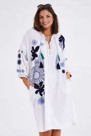 Model Monique wearing size 14 of the Now And Then Embroidered Tunic Dress in colour White (White), from the front, cropped image
