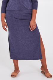Model Anucia wearing size 14 of the Snuggle Up Maxi Skirt in colour Marldenim (Blue), from the front, cropped image