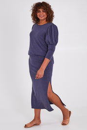 Model Anucia wearing size 14 of the Snuggle Up Maxi Skirt in colour Marldenim (Blue), from the front, showing the whole outfit