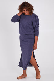Model Anucia wearing size 14 of the Snuggle Up Maxi Skirt in colour Marldenim (Blue), from the front, showing the whole outfit