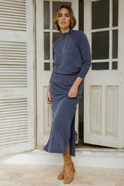 Model Tegan wearing size 10 of the Snuggle Up Maxi Skirt in colour Marldenim (Blue), from the front, showing the whole outfit