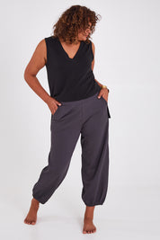 Model Anucia wearing size 14 of the Keeping It Cool Boyfriend Pants in colour Castle (Grey), from the front, showing the whole outfit