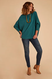Model Emma wearing size S of the Chill Vibes Slouch Top in colour Jade (Green), from the front, showing the whole outfit