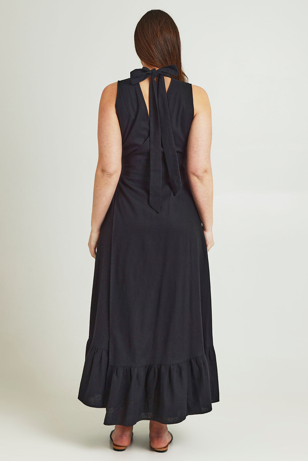 Model Jane wearing size 14 of the La Dolce Vita Back Wrap Maxi in colour Black (Black), from the back