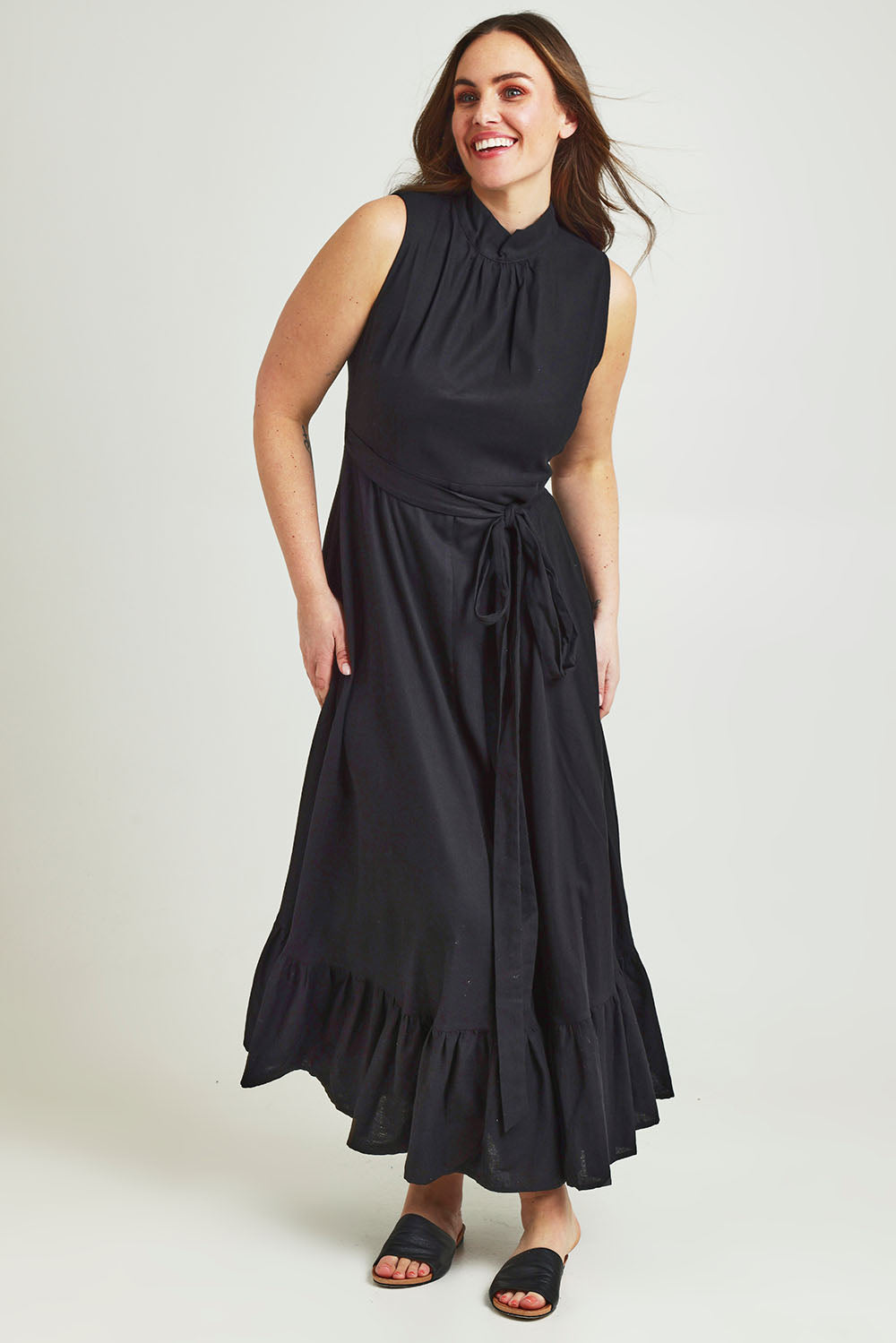 Model Jane wearing size 14 of the La Dolce Vita Back Wrap Maxi in colour Black (Black), from the front, showing the whole outfit