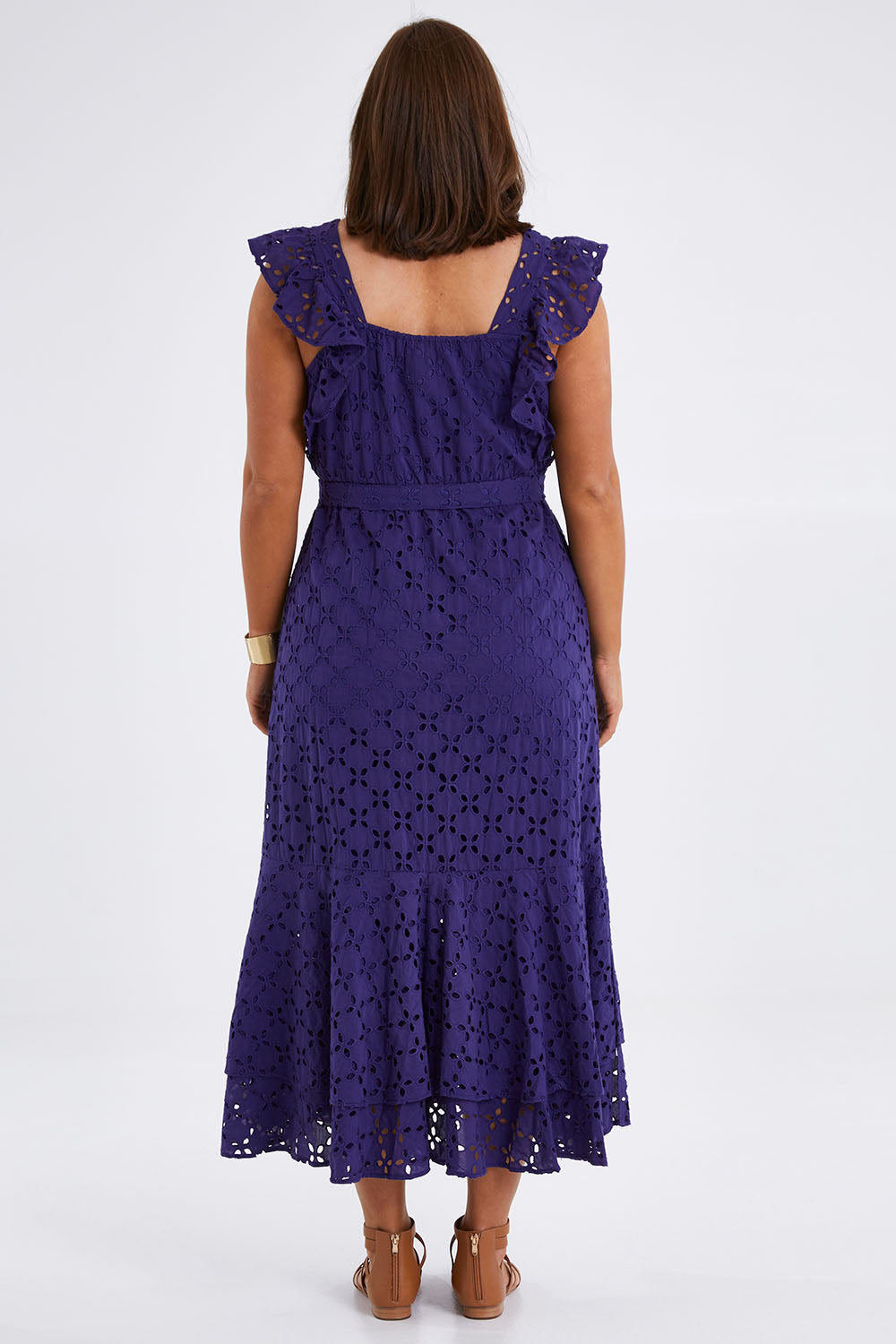 Model Monique wearing size 14 of the Beauty In Broderie Dress in colour Navy (Blue), from the back