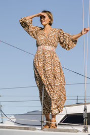 Model Tegan wearing size 10 of the Feel Good Friday Dress in colour Hazelnut (White), from the front, showing the whole outfit