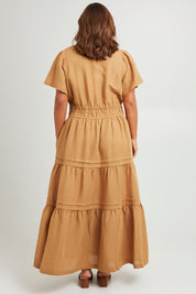 Model Monique wearing size 14 of the Forget Me Not Maxi Dress in colour Terracotta, from the back