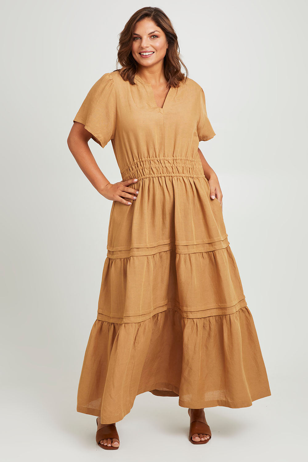 Model Monique wearing size 14 of the Forget Me Not Maxi Dress in colour Terracotta, from the front, showing the whole outfit