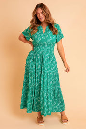 Model Laura wearing size 14 of the Forget Me Not Maxi Dress in colour Greenwhite (Green), from the front, showing the whole outfit