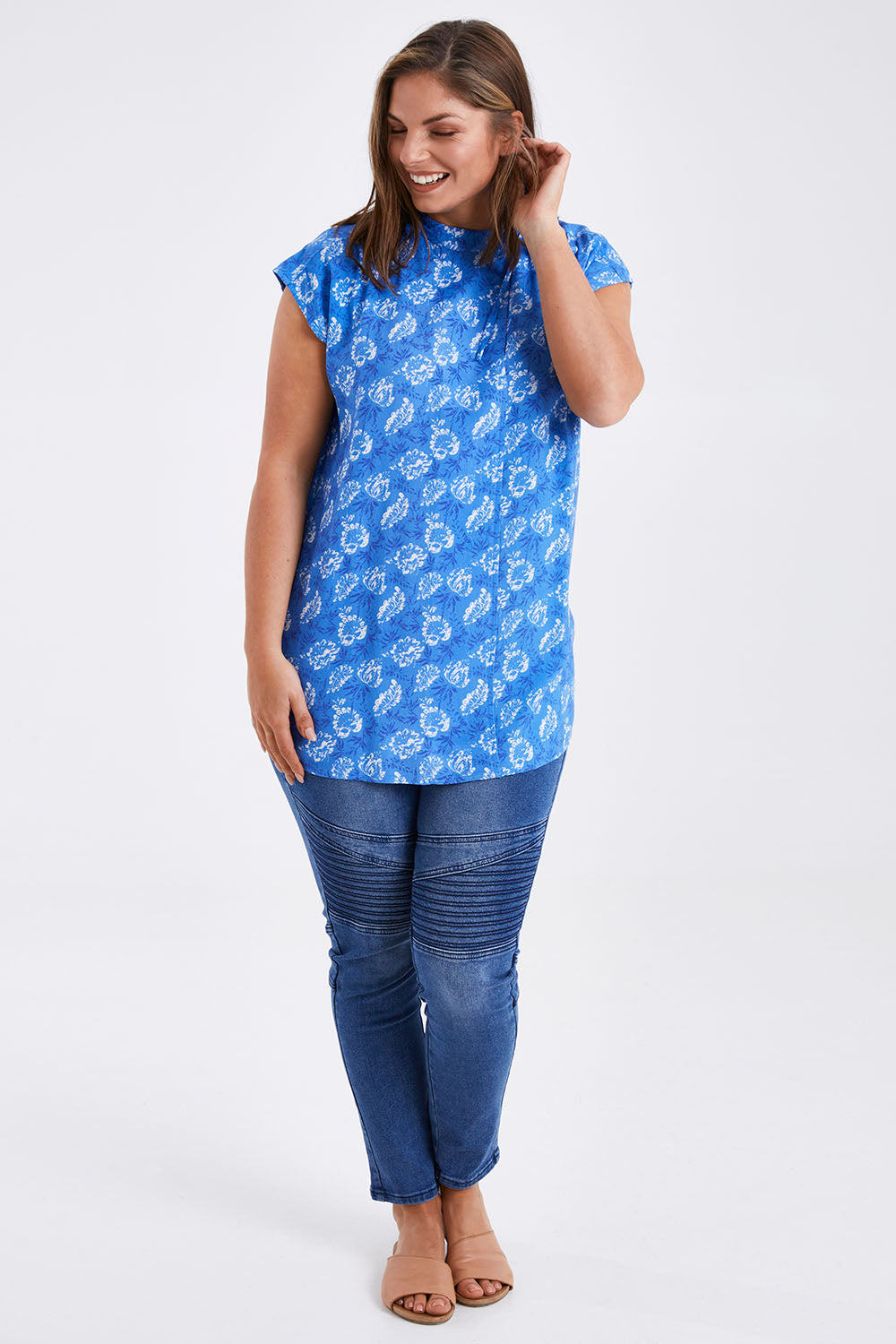 Model Monique wearing size 14 of the Forget Me Not Sleeveless Blouse in colour Bluewhite (Blue), from the front, showing the whole outfit
