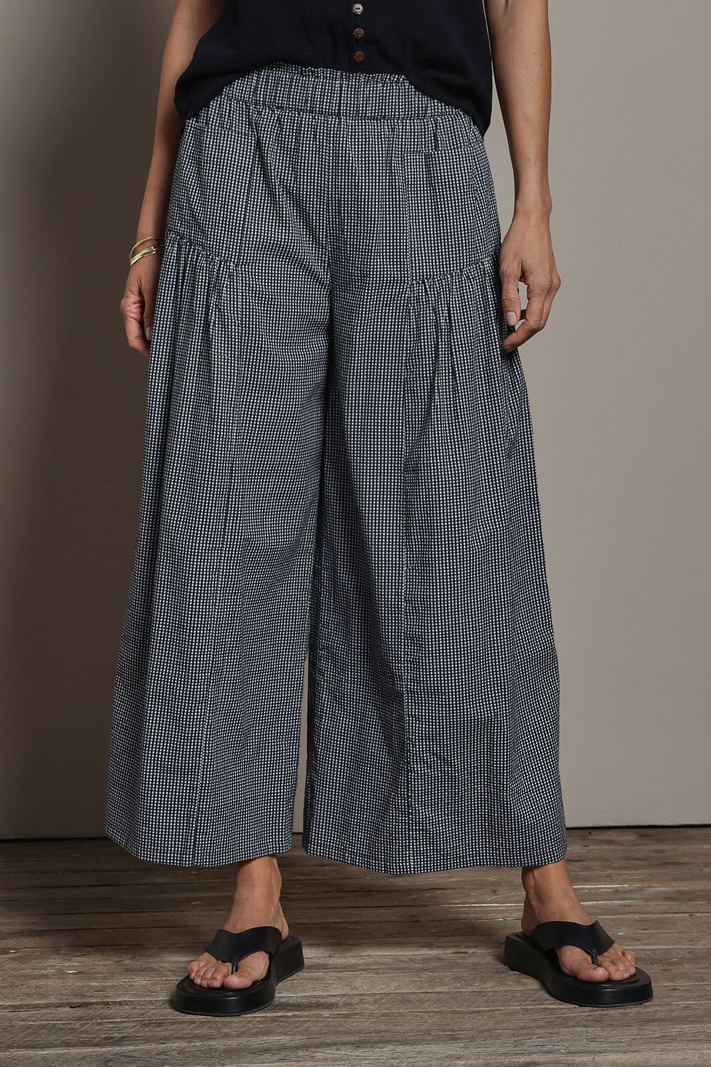 Model Amanda wearing size 10 of the Break Of Day Cotton Pants in colour Blackcheck (Black), from the front, cropped image
