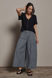 Model Amanda wearing size 10 of the Break Of Day Cotton Pants in colour Blackcheck (Black), from the front, showing the whole outfit