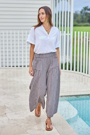 Model Tegand wearing size 10 of the Break Of Day Cotton Pants - Choccheck in colour Choccheck, from the front