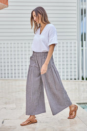 Model Tegand wearing size 10 of the Break Of Day Cotton Pants - Choccheck in colour Choccheck, from the front