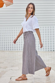 Model Tegand wearing size 10 of the Break Of Day Cotton Pants - Choccheck in colour Choccheck, from the front