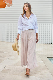 Model Tegand wearing size 10 of the Break Of Day Cotton Pants - Sandstripe in colour Sandstripe, from the front