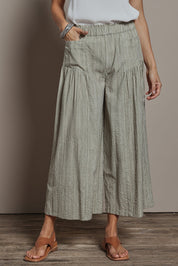 Model Amanda wearing size 10 of the Break Of Day Cotton Pants in colour Stone, from the front, cropped image