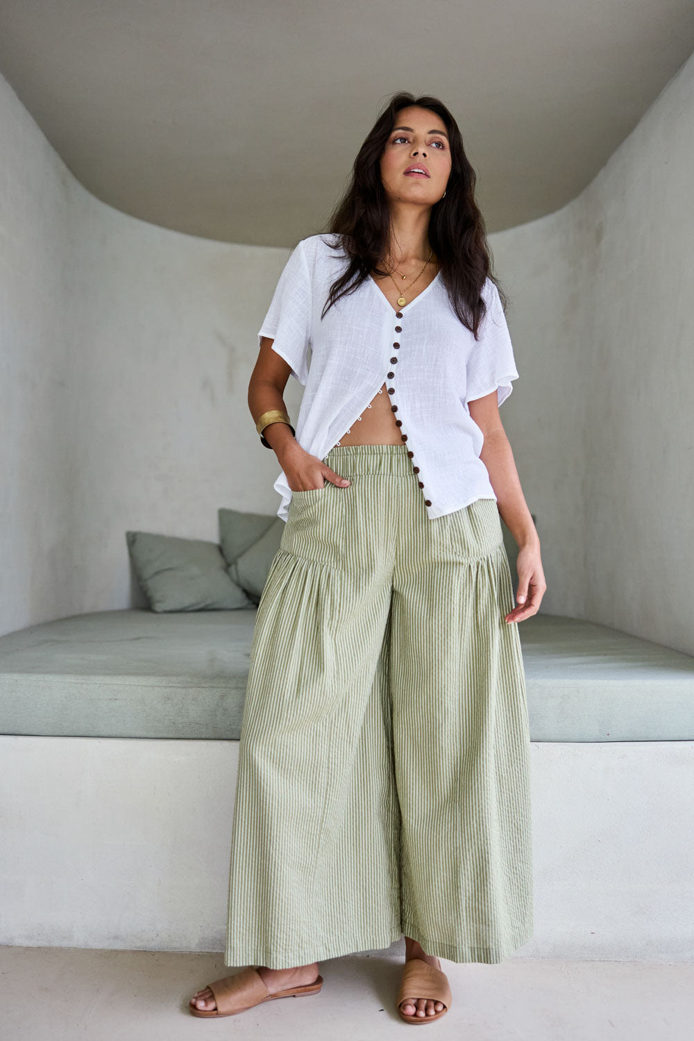 Model Tahnee wearing size 10 of the Break Of Day Cotton Pants in colour Stone, from the front, showing the whole outfit