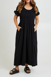 Model Laura wearing size 14 of the Casual Friday Dress in colour Black (Black), from the front, cropped image