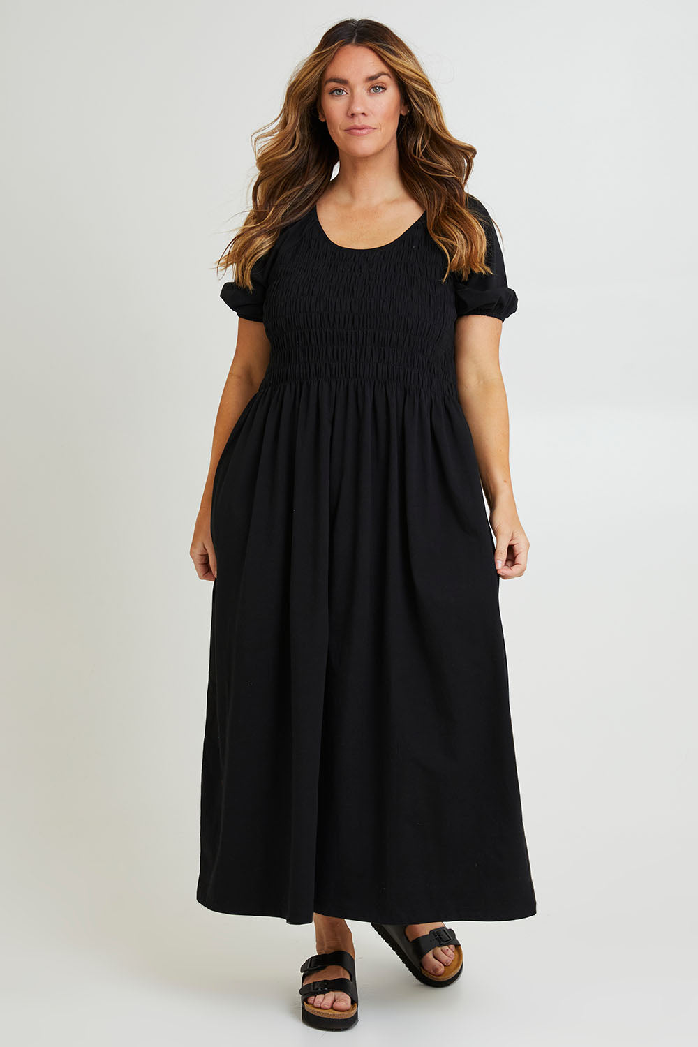 Model Laura wearing size 14 of the Casual Friday Dress in colour Black (Black), from the front, showing the whole outfit
