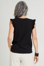 Model Luisa wearing size 10 of the For The Frill Of It Tee in colour Black (Black), from the back