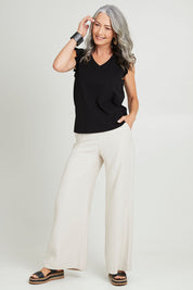 Model Luisa wearing size 10 of the For The Frill Of It Tee in colour Black (Black), from the front, showing the whole outfit