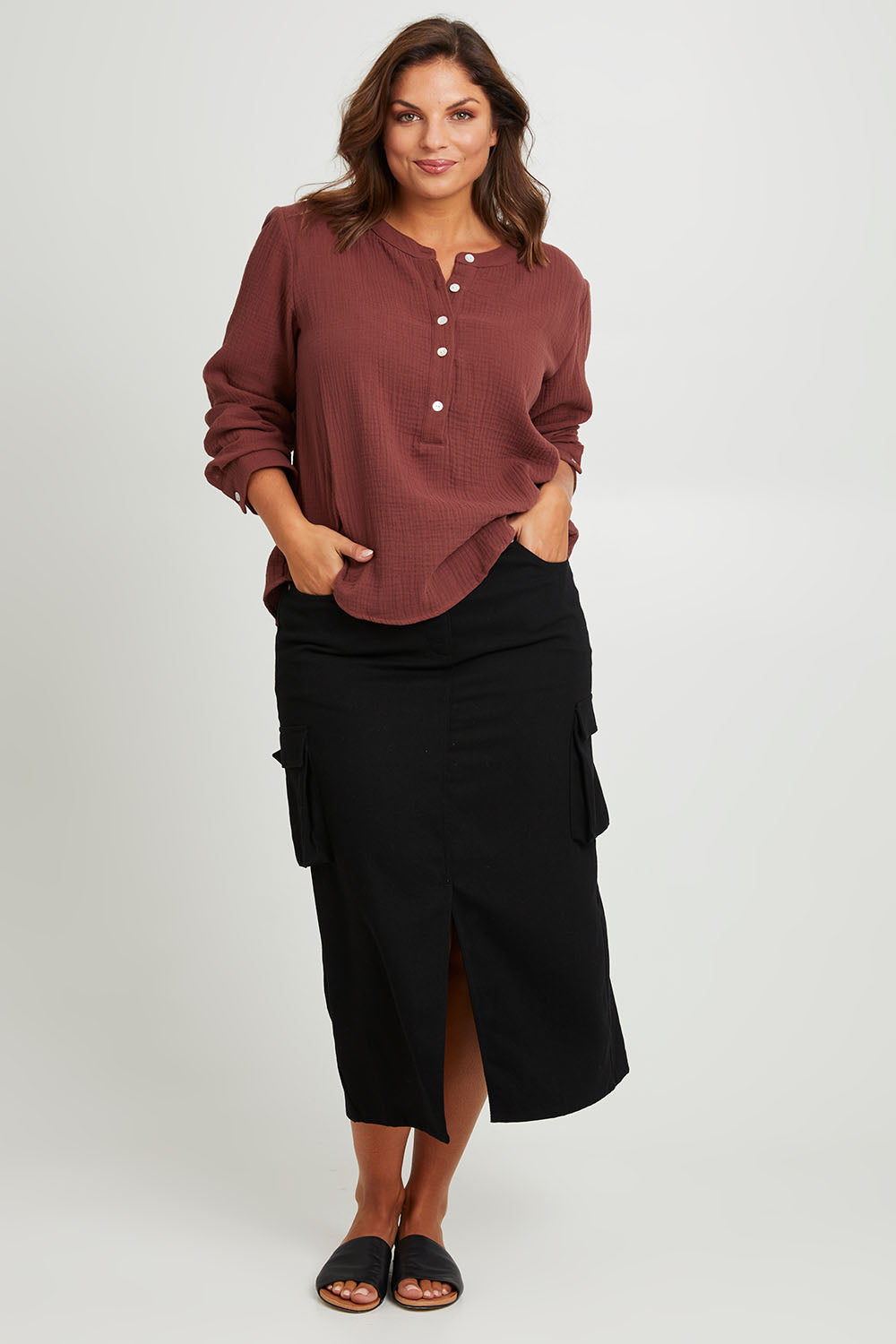 Model Monique wearing size 14 of the Carry Me With You Cargo Skirt in colour Black (Black), from the front, showing the whole outfit