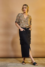 Model Tegan wearing size 10 of the Carry Me With You Cargo Skirt in colour Black (Black), from the front, showing the whole outfit