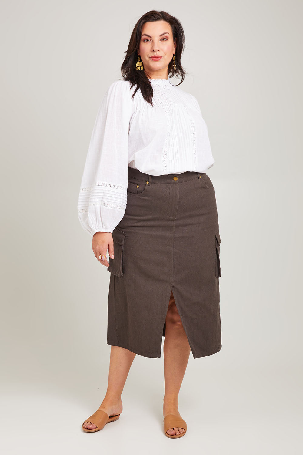 Model Poppy wearing size 16 of the Carry Me With You Cargo Skirt in colour Concrete (Grey), from the front, showing the whole outfit