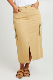 Model Monique wearing size 14 of the Carry Me With You Cargo Skirt in colour Sand, from the front, cropped image