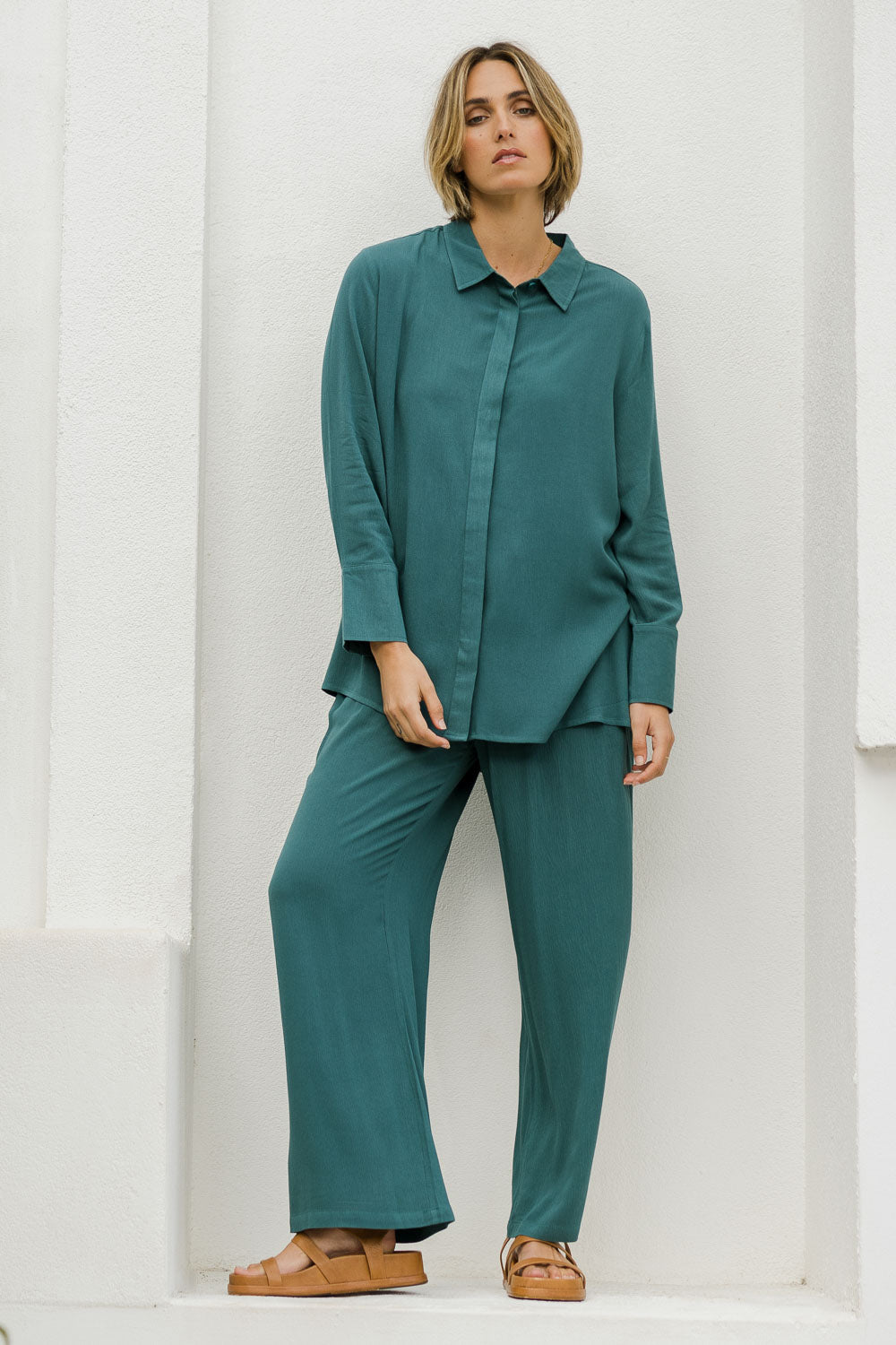 Model Tegan wearing size 10 of the Brunch Lunch And Dinner Shirt in colour Sage (Green), from the front, showing the whole outfit