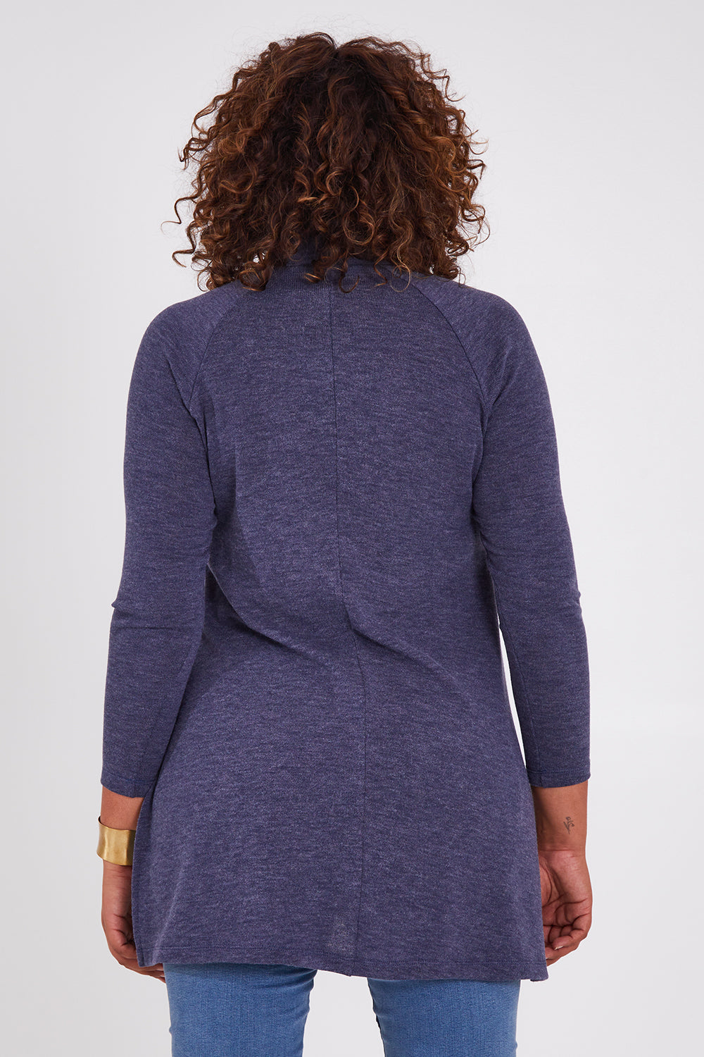 Model Anucia wearing size 14 of the Snuggle Up Tunic Top in colour Marldenim (Blue), from the back