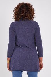 Model Anucia wearing size 14 of the Snuggle Up Tunic Top in colour Marldenim (Blue), from the back