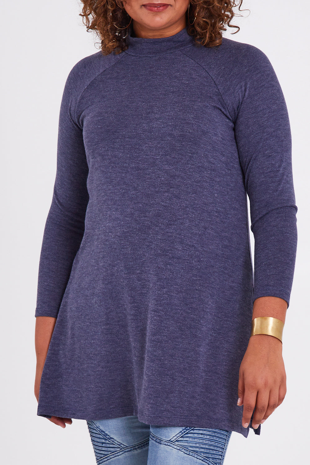 Model Anucia wearing size 14 of the Snuggle Up Tunic Top in colour Marldenim (Blue), from the front, cropped image