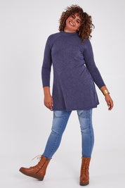 Model Anucia wearing size 14 of the Snuggle Up Tunic Top in colour Marldenim (Blue), from the front, showing the whole outfit