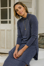 Model Tegan wearing size 10 of the Snuggle Up Tunic Top in colour Marldenim (Blue), from the front, showing the whole outfit