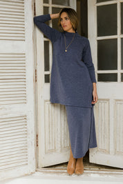 Model Tegan wearing size 10 of the Snuggle Up Tunic Top in colour Marldenim (Blue), from the front, showing the whole outfit