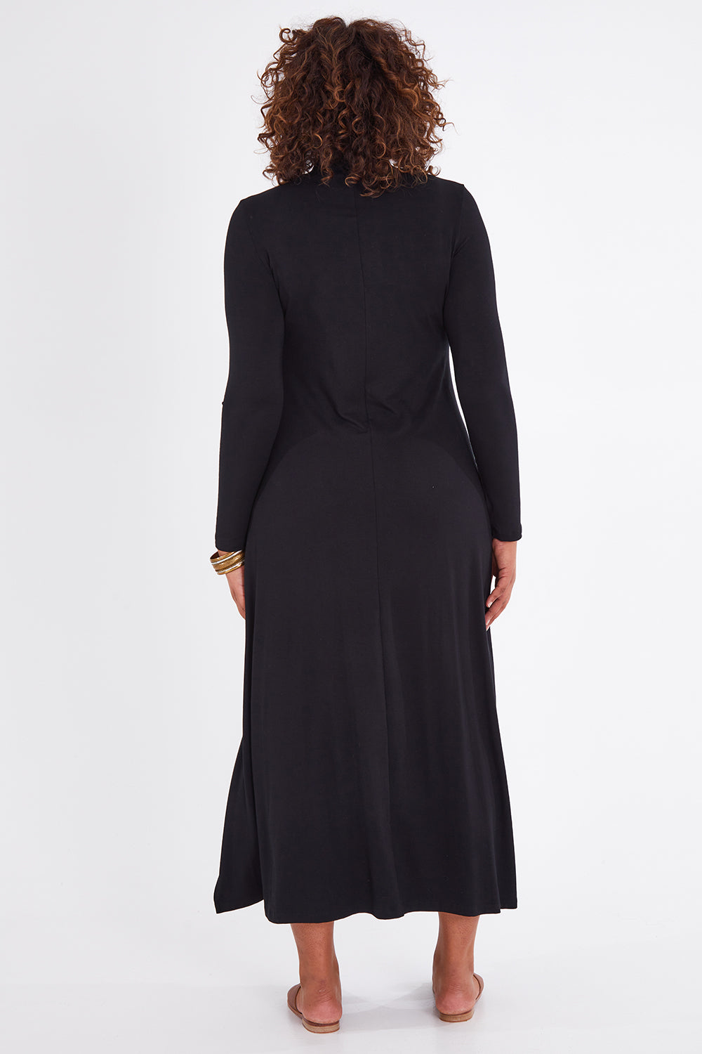 Model Anucia wearing size 14 of the My Faithful Maxi Tee Skivvy Dress in colour Black (Black), from the back