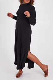 Model Anucia wearing size 14 of the My Faithful Maxi Tee Skivvy Dress in colour Black (Black), from the front, cropped image