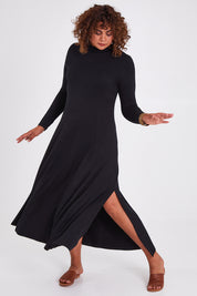 Model Anucia wearing size 14 of the My Faithful Maxi Tee Skivvy Dress in colour Black (Black), from the front, showing the whole outfit