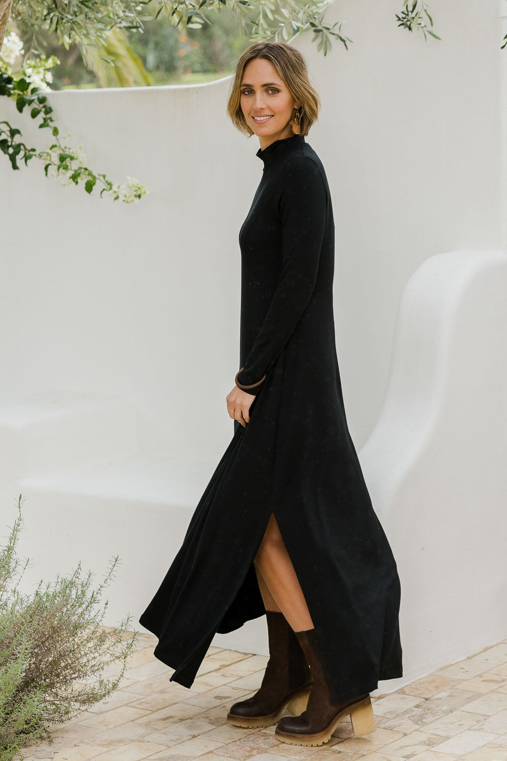 Model Tegan wearing size 10 of the My Faithful Maxi Tee Skivvy Dress in colour Black (Black), from the front, showing the whole outfit