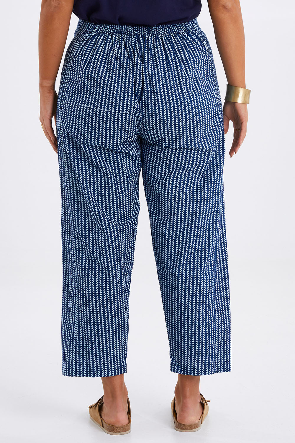 Model Monique wearing size 14 of the Relaxed Vibes Cotton Pants in colour Indigo (Blue), from the back