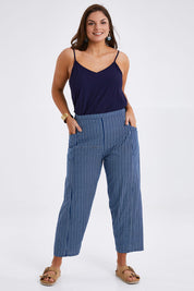 Model Monique wearing size 14 of the Relaxed Vibes Cotton Pants in colour Indigo (Blue), from the front, showing the whole outfit