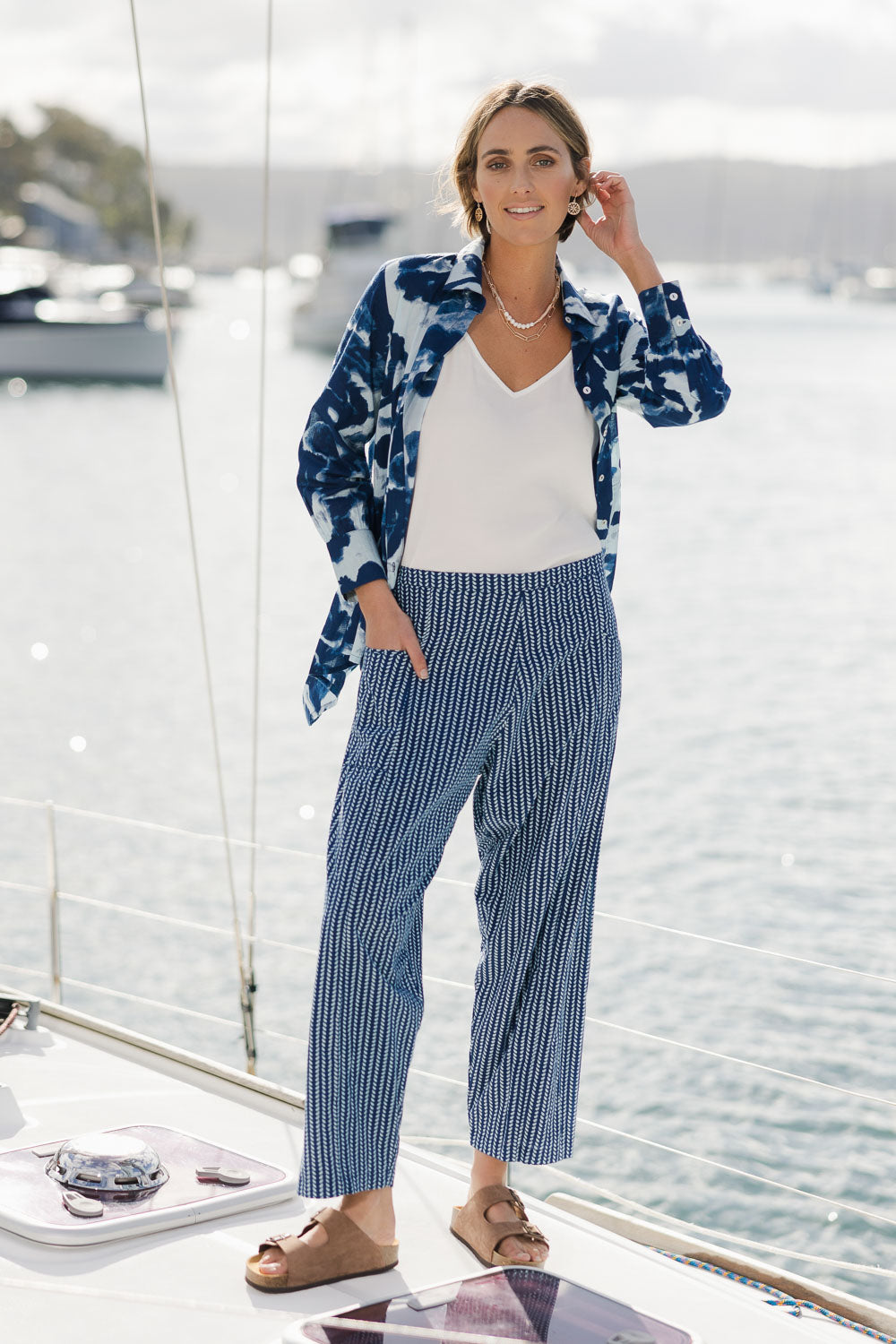 Model Tegan wearing size 10 of the Relaxed Vibes Cotton Pants in colour Indigo (Blue), from the front, showing the whole outfit