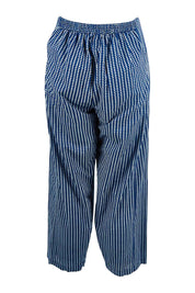 Product shot of the Relaxed Vibes Cotton Pants in colour Indigo (Blue), from the back